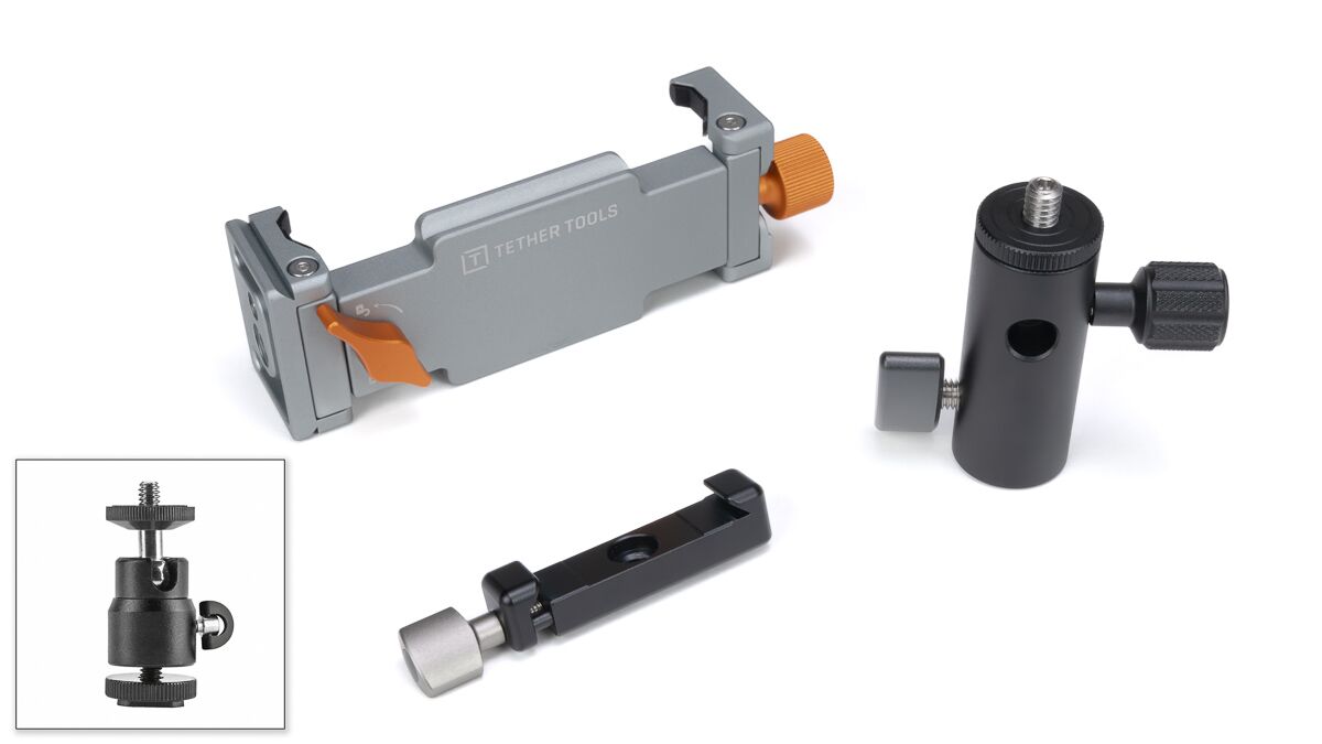 Modular camera accessory kit including a gray Tether Tools clamp with orange levers, a black mounting arm, and a small adjustable joint piece