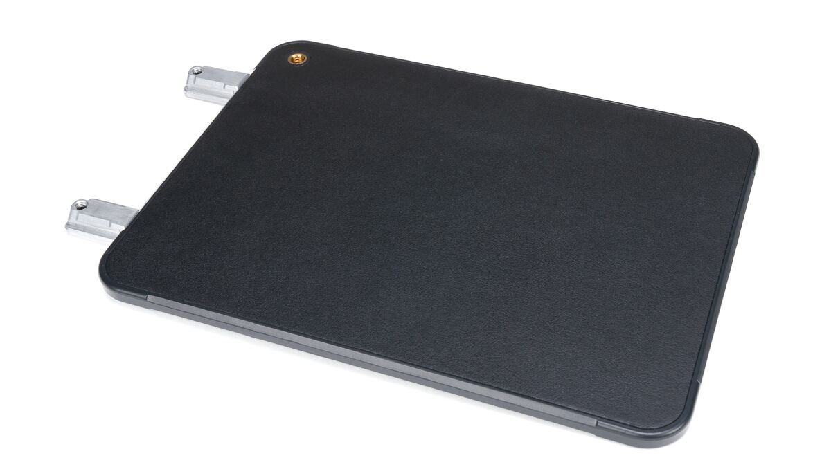 Black rectangular external hard drive enclosure with two metal connectors on the left side.