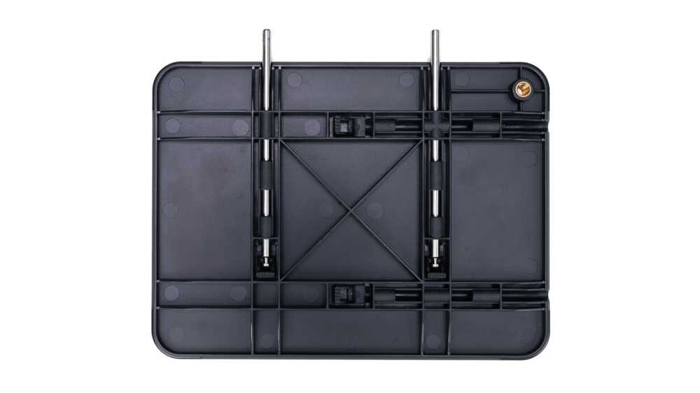 Bottom view of a black plastic device base with metal support rods and screw mounts