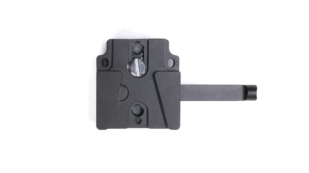 Black tripod quick-release plate with a sliding dovetail and mounting screw, extending a long rail to the right