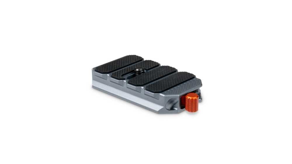 Four-segment expression pedal with black rubber foot pads and an orange side knob on the right side.