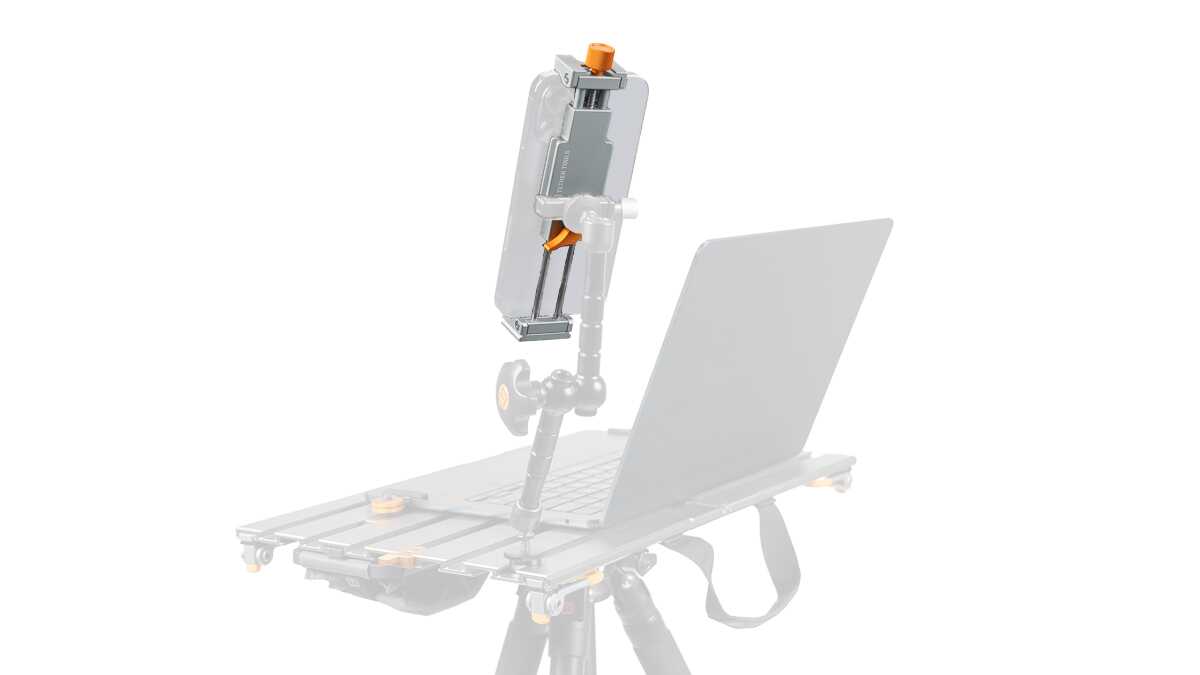Camera rig with an articulated arm holding a tablet/phone mounted above a laptop on a wheeled base, for on-site shooting setups (informative)