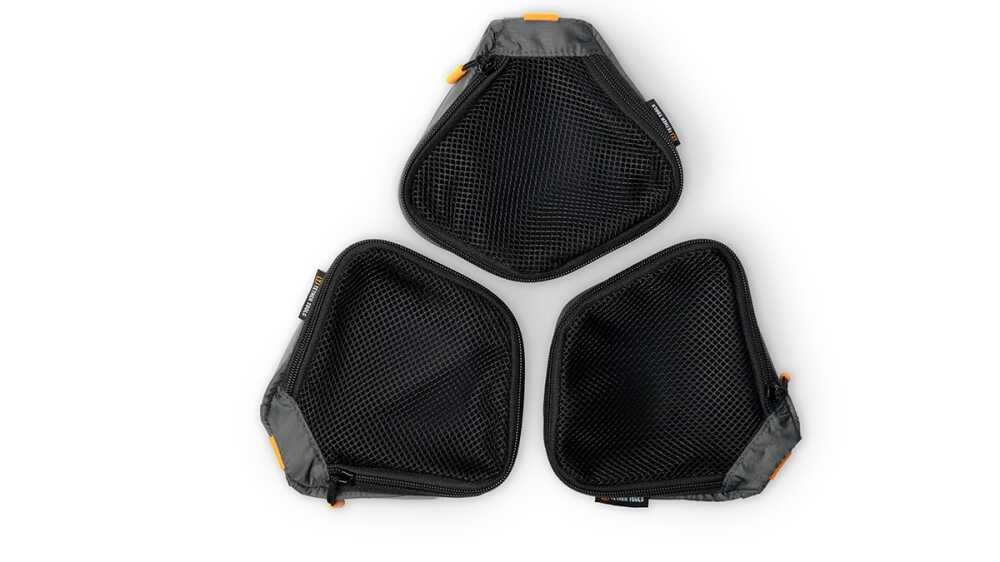 Three black mesh zippered pouches arranged in a triangular layout with orange zipper pulls and gray edges.