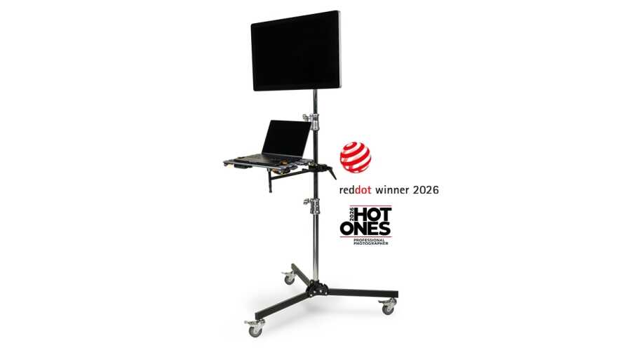Photography light/monitor stand on wheels with laptop tray and awards logos (reddot winner 2026, HOT ONES).